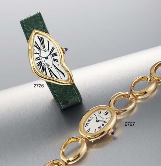CARTIER. A LADY'S 18K GOLD OVAL WRISTWATCH WITH BRACELET