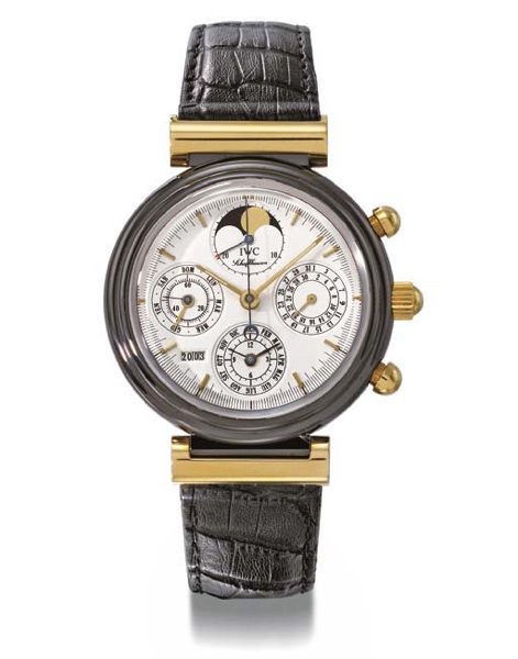 IWC. An unusual 18K gold and black ceramic self-winding perpetual calendar chronograph wristwatch with phases of the moon and year indicator