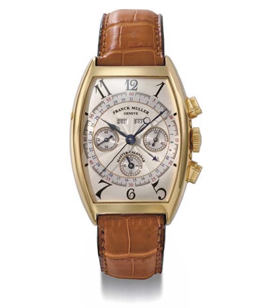 Franck Muller. A fine and large 18K gold tonneau-shaped curved triple calendar chronograph wristwatch