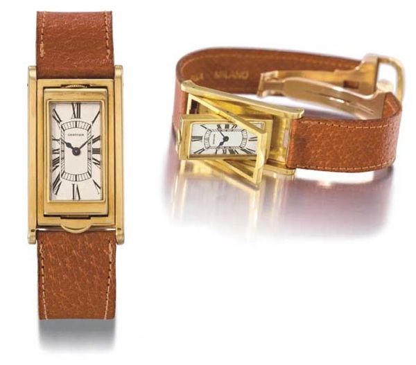 Cartier. A very fine and rare 18K gold rectangular reversible wristwatch