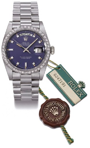 Rolex. An 18K white gold and diamond-set self-winding water-resistant calendar wristwatch with sweep centre seconds and bracelet