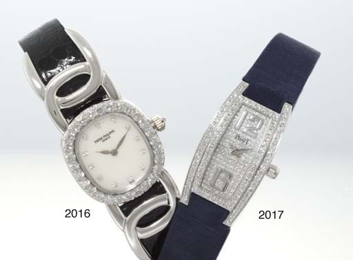 PATEK PHILIPPE. A FINE LADY'S 18K WHITE GOLD AND DIAMOND-SET OVAL WRISTWATCH WITH MOTHER-OF-PEARL DIAL