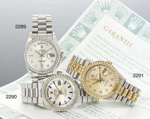 ROLEX. AN 18K WHITE GOLD, DIAMOND AND SAPPHIRE-SET AUTOMATIC WRISTWATCH WITH SWEEP CENTRE SECONDS, DAY, DATE AND BRACELET