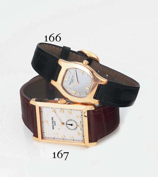 PATEK PHILIPPE. A LADY'S 18K GOLD TONNEAU WRISTWATCH