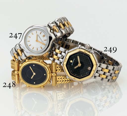 GERALD GENTA. A LADY'S 18K GOLD AND STAINLESS STEEL BRACELET WATCH WITH DATE