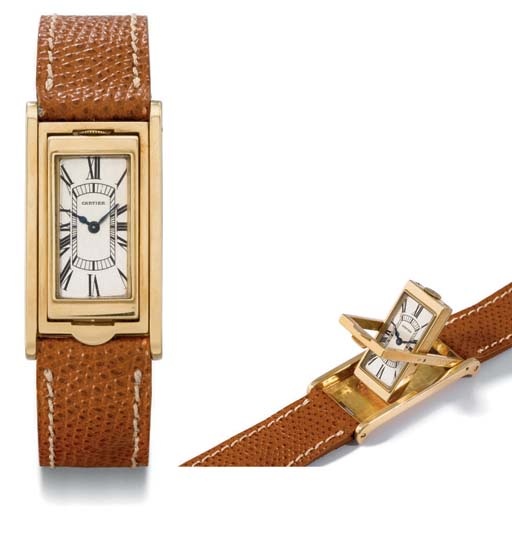 Cartier. A very fine and rare 18K gold rectangular reversible wristwatch