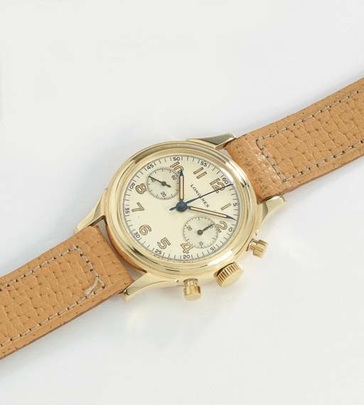 Longines. A fine 14K gold water-resistant chronograph wristwatch