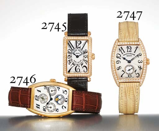 FRANCK MULLER. AN 18K GOLD TONNEAU-SHAPED PERPETUAL CALENDAR WRISTWATCH WITH PHASES OF THE MOON