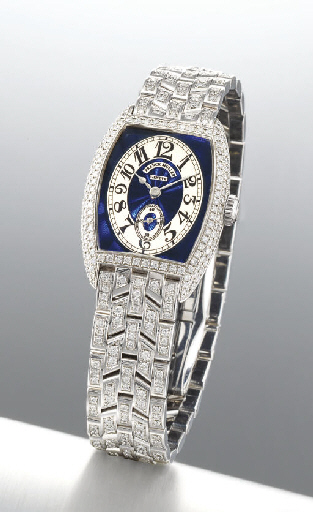 FRANCK MULLER. A RARE LADY'S 18K WHITE GOLD AND DIAMOND-SET TONNEAU-SHAPED WRISTWATCH WITH BRACELET AND ENAMEL DIAL