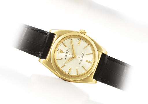 ROLEX. A 14K GOLD AUTOMATIC WRISTWATCH WITH CENTRE SECONDS
