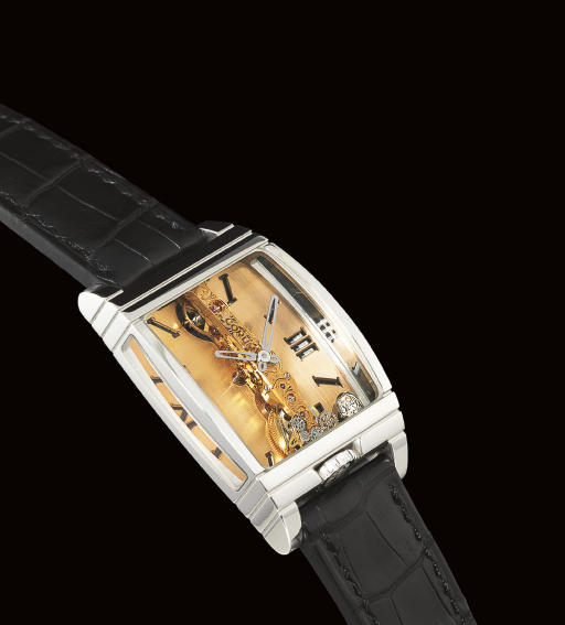 CORUM. A FINE AND VERY RARE LIMITED EDITION PLATINUM TONNEAU-SHAPED WRISTWATCH WITH VISIBLE SINGLE-LINE MOVEMENT