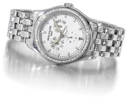 Patek Philippe. A fine and rare 18K white gold and diamond-set self-winding water-resistant annual calendar wristwatch with sweep centre seconds, date and bracelet