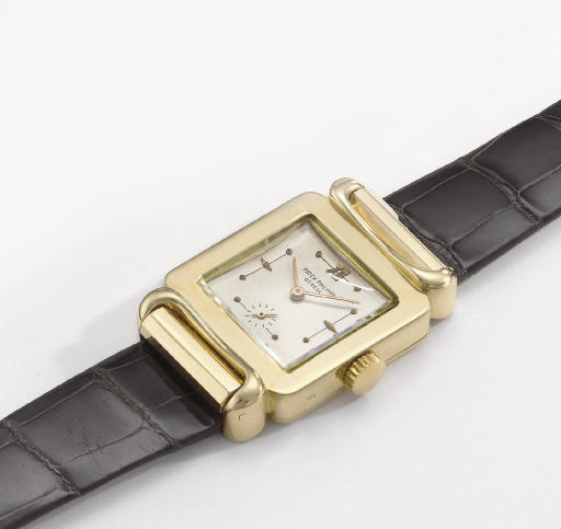 Patek Philippe. A very rare and unusual 18K gold square wristwatch with hooded lugs