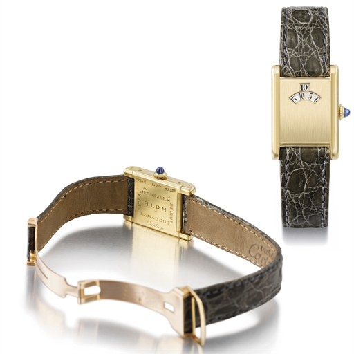 Cartier. An extremely fine and rare 18K gold rectangular jump hour wristwatch