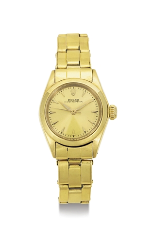 ROLEX. A LADY'S 18K GOLD AUTOMATIC WRISTWATCH WITH CENTER SECONDS AND BRACELET