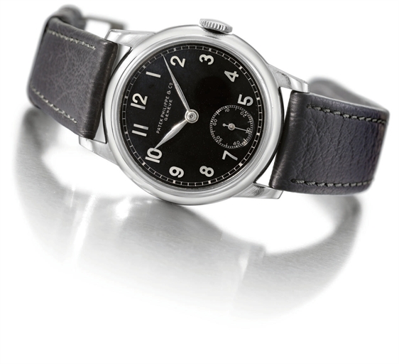 Patek Philippe. A fine, rare and unusual stainless steel wristwatch with black dial