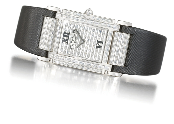 Patek Philippe. A lady's very fine and impressive 18K white gold and diamond-set rectangular wristwatch