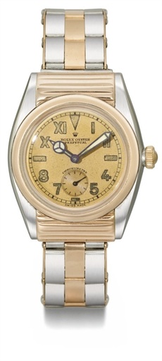 Rolex. A very rare and attractive stainless steel and pink gold automatic bubble back wristwatch with ribbed hooded lugs, pink California dial and bracelet