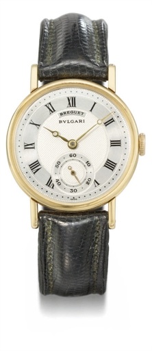 Breguet. An 18K gold wristwatch