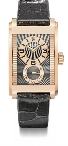 Rolex. An 18K pink gold rectangular curved wristwatch with black dial