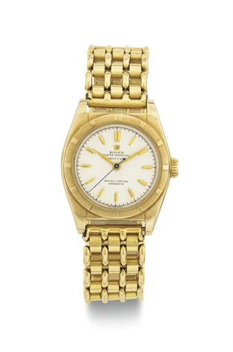 ROLEX. A 14K GOLD AUTOMATIC BUBBLE BACK WRISTWATCH WITH CENTER SECONDS