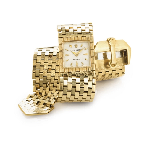ROLEX. A RARE AND UNUSUAL LADY'S 18K GOLD BRACELET WATCH IN THE FORM OF A BELT