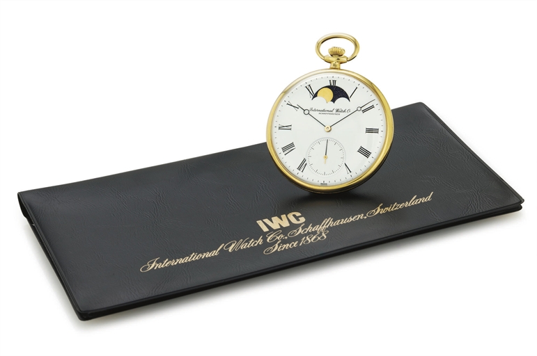 IWC. AN 18K GOLD OPENFACE KEYLESS LEVER DRESS WATCH WITH MOON PHASES