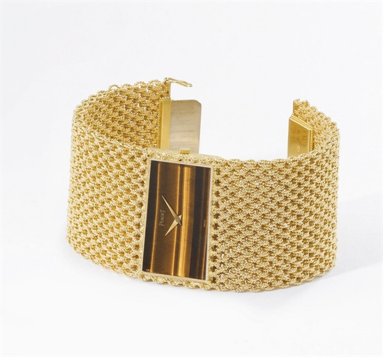 Piaget. A highly unusual 18K gold and tiger's eye oblong bracelet wristwatch