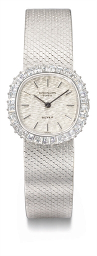 Patek Philippe. A lady's fine 18K white gold and diamond-set cushion-shaped wristwatch with bracelet