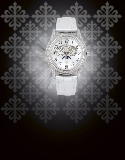 PATEK PHILIPPE, REF. 4937G.LADY'S WHITE GOLD AND DIAMOND-SET AUTOMATIC ANNUAL CALENDAR WRISTWATCH WITH MOON PHASE DISPLAY AND MOTHER-OF-PEARL DIAL