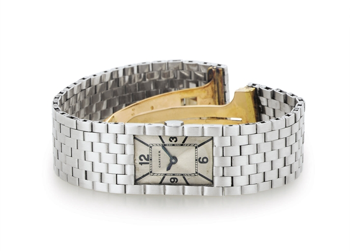 CARTIER. A LADY'S FINE AND VERY RARE PLATINUM BRACELET WATCH