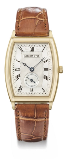 Breguet. An 18K gold tonneau-shaped curved automatic wristwatch