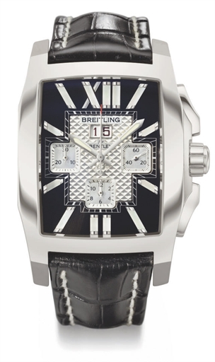 Breitling. A large stainless steel rectangular-shaped automatic chronograph wristwatch with date, two-tone dial and mother-of-pearl numerals