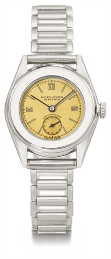 Rolex. A rare mid-size stainless steel automatic wristwatch with champagne dial and bracelet