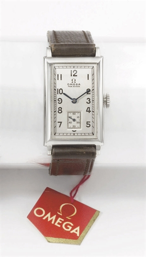 Omega. A stainless steel rectangular curved wristwatch with original sales tag and box
