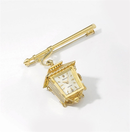Rolex. An unusual 18K gold lantern-form brooch watch