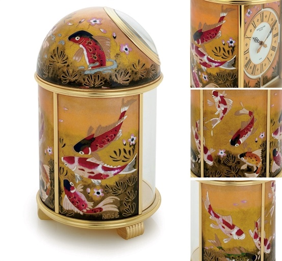 PATEK PHILIPPE. A FINE AND UNIQUE GILT BRASS SOLAR POWERED DESK CLOCK WITH CLOISONN