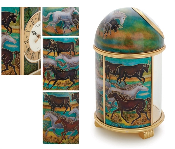 PATEK PHILIPPE. A FINE AND UNIQUE GILT BRASS SOLAR POWERED DESK CLOCK WITH CLOISONN
