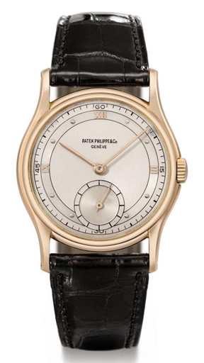 Patek Philippe. A rare 18K pink gold wristwatch with two-tone silvered dial