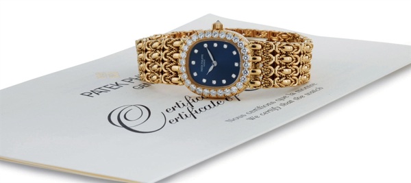 PATEK PHILIPPE. A LADY'S FINE 18K GOLD AND DIAMOND CUSHION BRACELET WATCH