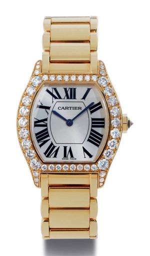 CARTIER. A LADY'S 18K GOLD AND DIAMOND WRISTWATCH WITH BRACELET