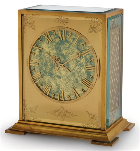 PATEK PHILIPPE. A FINE GILT BRASS SOLAR-POWERED DESK CLOCK