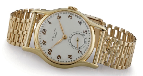 PATEK PHILIPPE. AN 18K GOLD WRISTWATCH WITH BREGUET NUMERALS