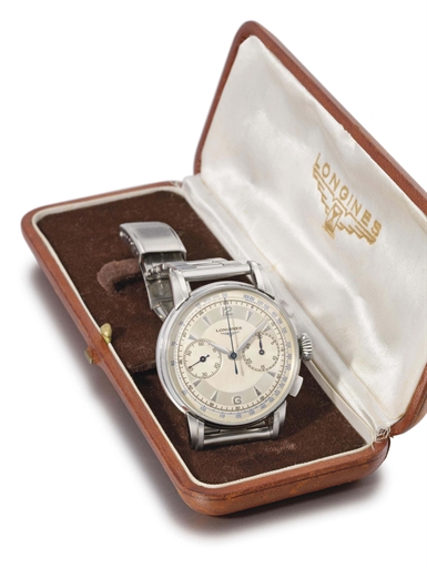 Longines. A fine stainless steel flyback chronograph wristwatch with two-tone silvered dial and box