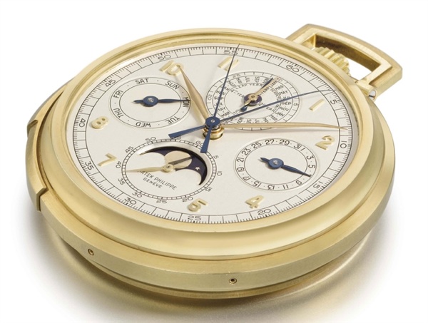 Patek Philippe. A fine and rare 18K gold openface minute repeating perpetual calendar split seconds chronograph keyless lever watch with moon phases and box