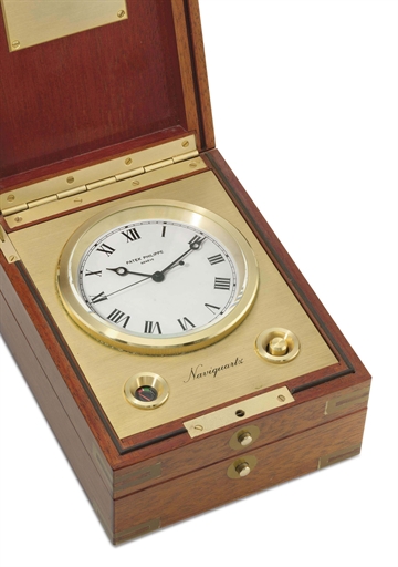 Patek Philippe. A gilt metal electronic marine chronometer with sweep centre seconds, in mahogany box