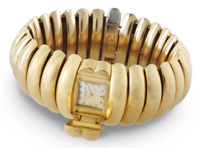 VACHERON CONSTANTIN. A LADY'S RARE AND UNUSUAL 18K GOLD BRACELET WATCH WITH CONCEALED DIAL