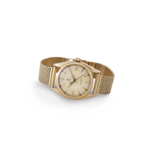 ROLEX. A RARE 18K PINK GOLD AUTOMATIC WRISTWATCH WITH CENTER SECONDS, HONEYCOMB DIAL AND BRACELET