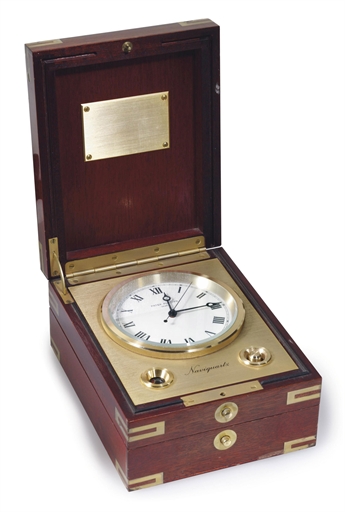 PATEK PHILIPPE. A BRASS AND WOOD ELECTRONIC MARINE CHRONOMETER WITH JUMPING CENTER SECONDS, POWER RESERVE AND MAHOGANY BOX