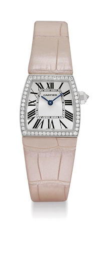 CARTIER. A LADY'S FINE 18K WHITE GOLD AND DIAMOND-SET TRAPEZOIDAL WRISTWATCH